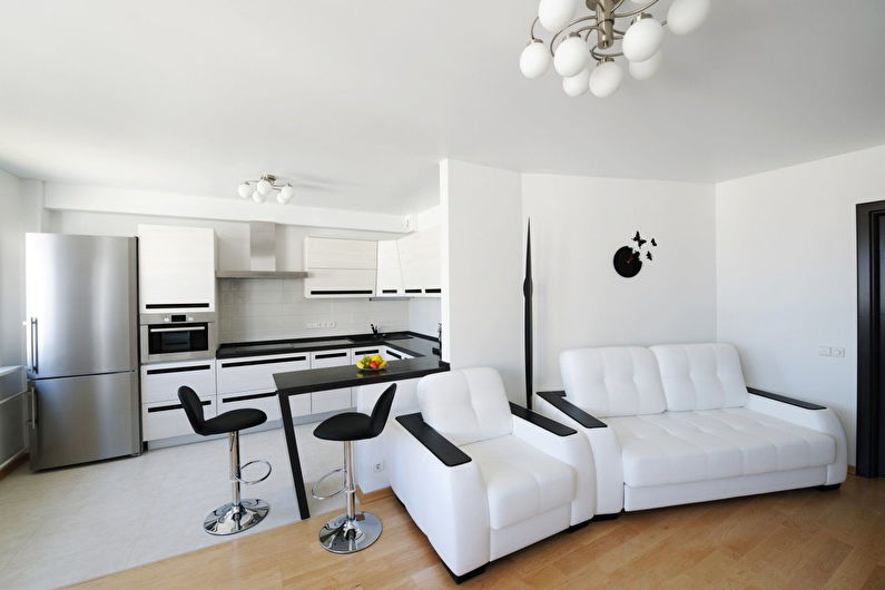 Дизайн интерьера белой кухни-гостиной - фото