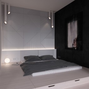 Спальное ложе в комнате минималистического стиля