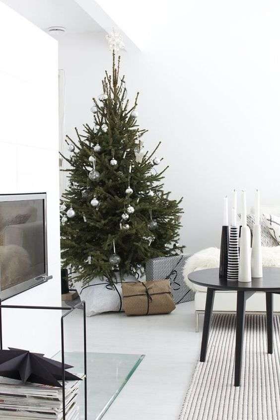 05-a-modern-scandi-christmas-tree-with-white-clear-and-metallic-ornaments-and-no-lights-for-a-laconic-look-9070733