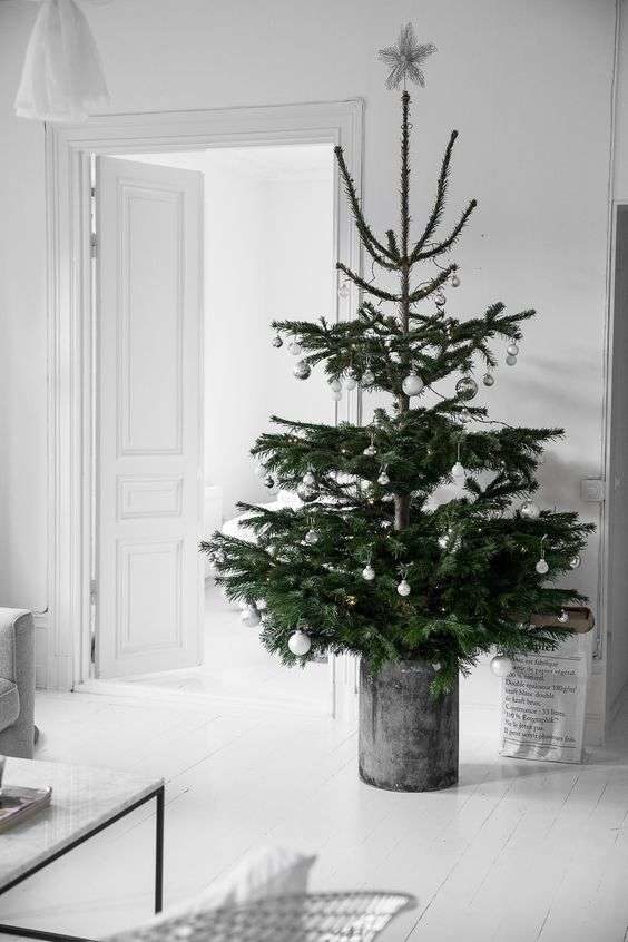 08-a-nordic-christmas-tree-with-silver-and-white-ornaments-in-a-galvanized-bucket-is-a-chic-idea-for-a-modern-space-6184027