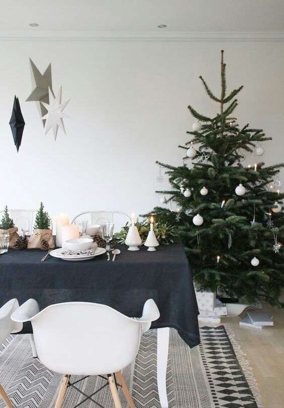 14-a-modern-scandi-christmas-tree-with-white-ornaments-stars-snowflakes-and-balls-and-some-lights-4029963