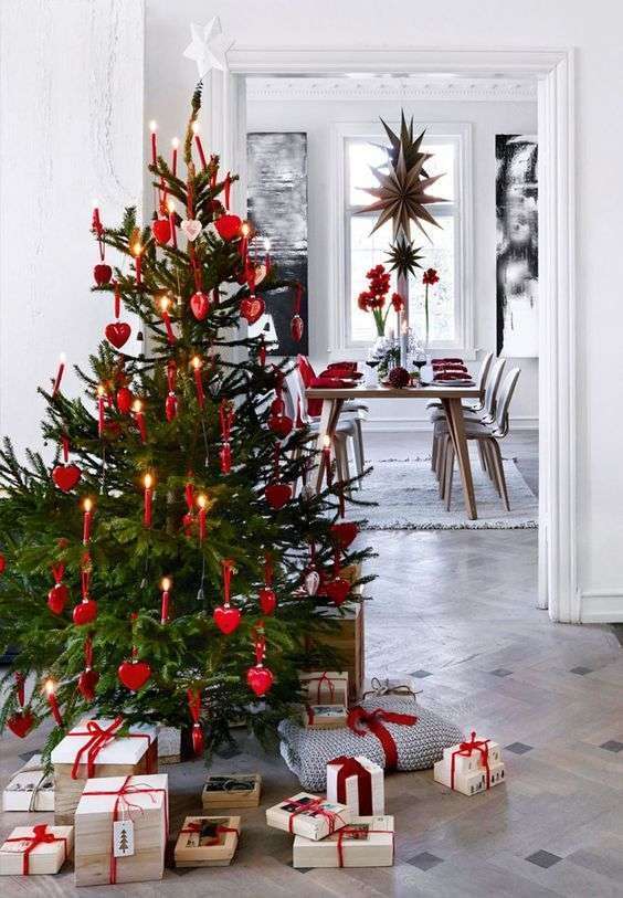 18-a-cute-traditional-christmas-tree-with-red-ornaments-and-real-candles-plus-a-white-star-topper-3807392